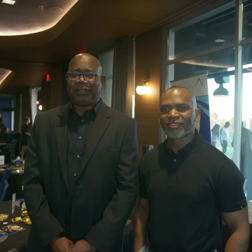 Two LAEA members at the Sneaker Ball installation